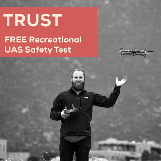 FAA Trust Course Man holding a drone with text about a free recreational UAS safety test on a red background